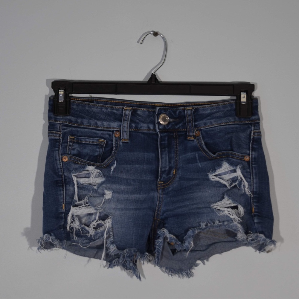 Distressed midi dark denim shorts